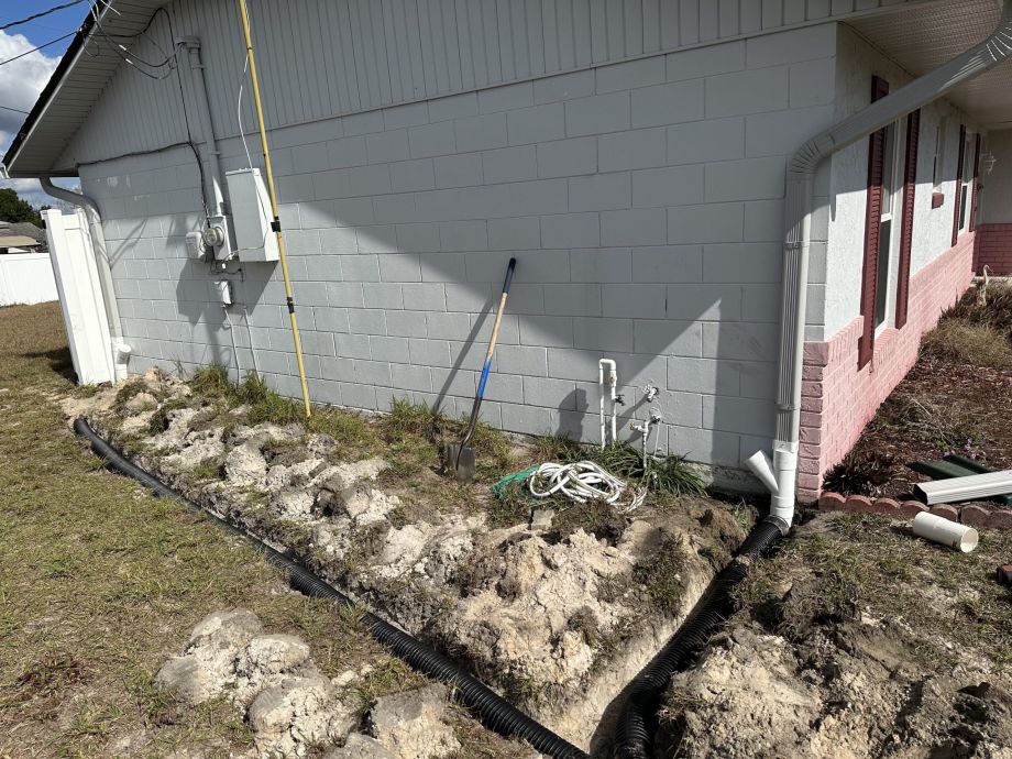 Trenches Dug In Florida Dirt For Gutter Drainage Piping