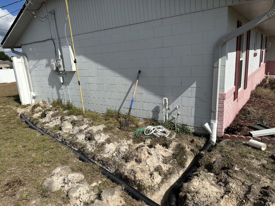 Trenches Dug In Florida Dirt For Gutter Drainage Piping